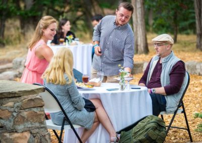 couple is served their meal during family camp date night