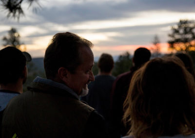 adults take in view of sunset during educators escape