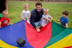 childcare worker working with kids