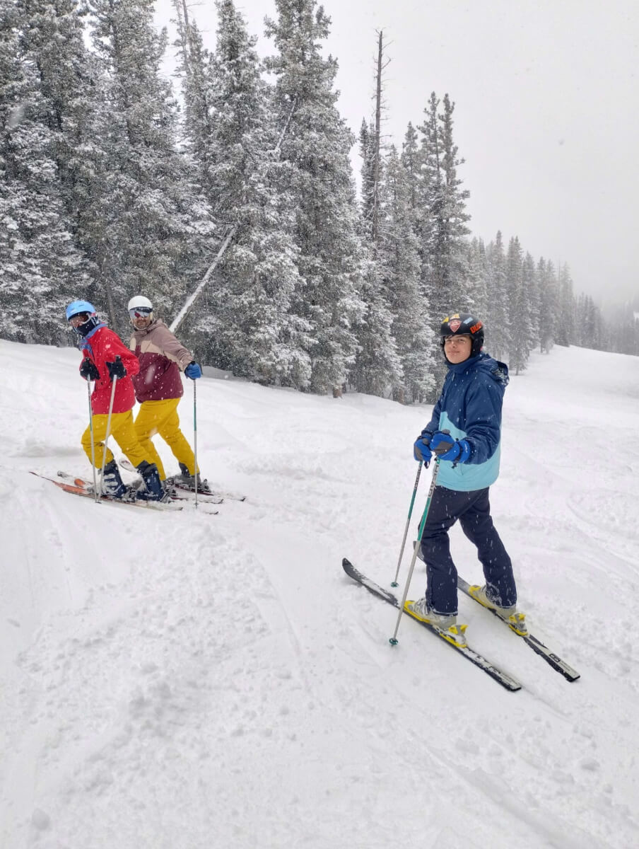 3 people skiing