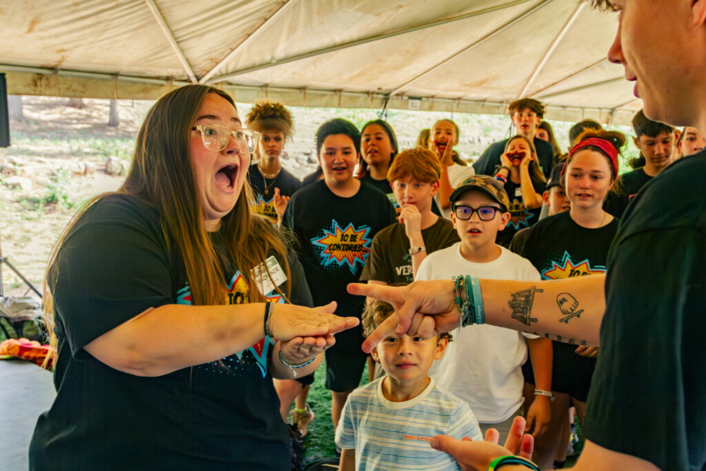 Summer Staff together with campers in background